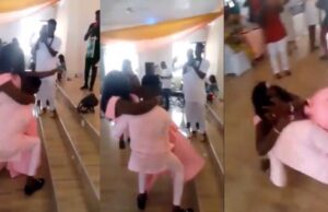 Newlyweds fall flat while dancing at their wedding