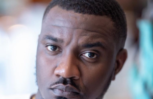 John Dumelo backing on set